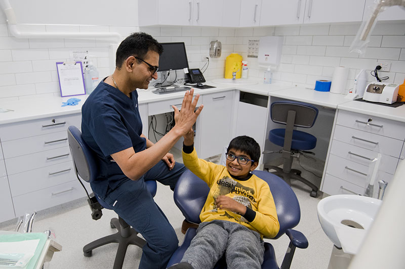 Dr Nishant speaking with a patient at Warrnambool Dental